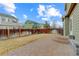 Spacious backyard with brick patio and tall wood fence, perfect for outdoor entertaining and privacy at 10505 Wheeling St, Commerce City, CO 80022