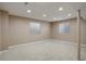 Spacious basement with neutral carpet, recessed lighting, and multiple windows at 10505 Wheeling St, Commerce City, CO 80022