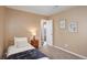 Bedroom featuring carpet floors, decorative wall art, and plenty of natural light at 10505 Wheeling St, Commerce City, CO 80022
