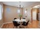 Elegant dining room featuring modern chandelier and a round table, perfect for gatherings at 10505 Wheeling St, Commerce City, CO 80022