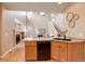 Open-concept view of the kitchen flowing into the living room, creating an inviting space at 10505 Wheeling St, Commerce City, CO 80022