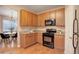 Well-equipped kitchen featuring modern appliances and ample cabinetry for storage at 10505 Wheeling St, Commerce City, CO 80022