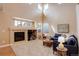 This expansive living room boasts a fireplace, large windows, and comfortable seating at 10505 Wheeling St, Commerce City, CO 80022
