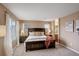 Comfortable main bedroom featuring two large windows with blinds, and a king size bed at 10505 Wheeling St, Commerce City, CO 80022
