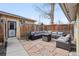 Charming backyard patio featuring comfortable seating around a fire pit at 3907 S Lincoln St, Englewood, CO 80113