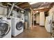 Basement laundry area featuring modern washer and dryer units at 3907 S Lincoln St, Englewood, CO 80113