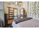 Bright bedroom featuring a stylish sliding barn door and soft, neutral tones, creating a peaceful and inviting atmosphere at 3907 S Lincoln St, Englewood, CO 80113