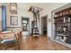 Bright dining room with hardwood floors, a quirky spiral staircase, and open shelving, creating a unique, stylish atmosphere at 3907 S Lincoln St, Englewood, CO 80113