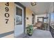 Inviting front porch featuring a hanging swing, perfect for enjoying a relaxing moment with a covered ceiling and pot of greenery at 3907 S Lincoln St, Englewood, CO 80113
