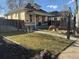 Charming home featuring a well-kept lawn, lovely landscaping, and inviting front porch, perfect for relaxing and enjoying the outdoors at 3907 S Lincoln St, Englewood, CO 80113