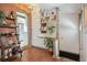 Hallway featuring decorative shelves, wood flooring, and view into kitchen at 3907 S Lincoln St, Englewood, CO 80113