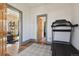 Room featuring a treadmill, hardwood floors and entryways to other living spaces at 3907 S Lincoln St, Englewood, CO 80113
