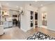 Chic kitchen with stainless steel appliances, wood floors, gray cabinets, laundry, and bathroom access at 4025 Jason St # 101, Denver, CO 80211
