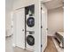 Convenient stacked washer and dryer unit tucked away with sliding door access at 4025 Jason St # 101, Denver, CO 80211