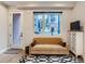 Bright living room with hardwood floors, modern rug, comfortable sofa and view of nearby apartment building at 4025 Jason St # 101, Denver, CO 80211