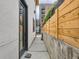 Narrow side yard path, perfect for discreet access and maintenance of the property at 4025 Jason St # 101, Denver, CO 80211
