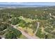 An aerial view of vast property in a tree-lined area featuring gorgeous mountain views at 5073 N Lariat Dr, Castle Rock, CO 80108