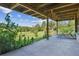 Back porch overlooking expansive backyard with seating; a nature lover's delight at 5073 N Lariat Dr, Castle Rock, CO 80108
