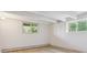 Finished basement featuring tile floors and windows with views of greenery at 5073 N Lariat Dr, Castle Rock, CO 80108