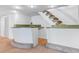 Finished basement boasts a stylish bar area and staircase to the upper level at 5073 N Lariat Dr, Castle Rock, CO 80108