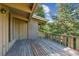 Spacious wooden deck, ideal for relaxation and outdoor living surrounded by trees at 5073 N Lariat Dr, Castle Rock, CO 80108