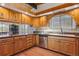 Well-maintained kitchen with custom cabinetry, stainless steel appliances, and countertops at 5073 N Lariat Dr, Castle Rock, CO 80108