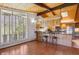 Eat-in kitchen offers a large window, wood cabinets, and an eat-at bar with room for seating at 5073 N Lariat Dr, Castle Rock, CO 80108