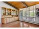 Elegant room with custom built-ins, hardwood floors, and sun-drenched windows at 5073 N Lariat Dr, Castle Rock, CO 80108