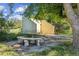Outdoor seating area featuring a stone table and unique building at 5073 N Lariat Dr, Castle Rock, CO 80108