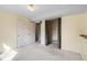 Bedroom featuring neutral carpet, trim, and walls with closet area at 7325 Taft Ct, Arvada, CO 80005