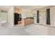 Functional kitchen area with cabinetry, black appliances, and counter seating at 7325 Taft Ct, Arvada, CO 80005