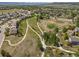 Aerial view of community featuring sidewalks, lush green spaces, and mountain views at 4194 Beautiful Cir, Castle Rock, CO 80109