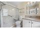 This bright bathroom showcases a sleek glass-enclosed shower and a stylish vanity with granite countertop at 4194 Beautiful Cir, Castle Rock, CO 80109
