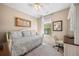 This bedroom includes a comfy daybed, ceiling fan, natural light, and built in desk, perfect for working at home at 4194 Beautiful Cir, Castle Rock, CO 80109