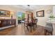 Well-lit dining room with hardwood floors and sliding door to outside patio area at 4194 Beautiful Cir, Castle Rock, CO 80109