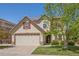 Charming two-story home with a two car garage, well-kept lawn, and mature landscaping at 4194 Beautiful Cir, Castle Rock, CO 80109