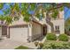 Charming home featuring stone accents, a two-car garage, and beautifully landscaped front yard at 4194 Beautiful Cir, Castle Rock, CO 80109