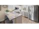 Modern kitchen boasts granite countertops, stainless steel appliances, and white cabinets at 4194 Beautiful Cir, Castle Rock, CO 80109