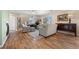 Bright living room features hardwood floors, a fireplace, neutral furnishings and plenty of natural light at 4194 Beautiful Cir, Castle Rock, CO 80109