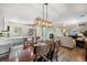 Open-concept living and dining area with a fireplace and adjacent kitchen at 4194 Beautiful Cir, Castle Rock, CO 80109