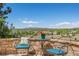 Enjoy beautiful views from this patio, complete with cozy seating and a charming outdoor table at 4194 Beautiful Cir, Castle Rock, CO 80109
