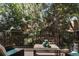 Balcony with outdoor furniture and serene wooded views at 16052 Deer Ridge Dr # B, Morrison, CO 80465