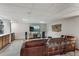 Basement with wet bar, full-sized cabinets, bar refrigerator, and comfortable seating area with a big-screen television at 16052 Deer Ridge Dr # B, Morrison, CO 80465