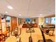 Basement with carpet, workout equipment, television, and tan leather sofa in a finished space at 16052 Deer Ridge Dr # B, Morrison, CO 80465
