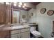 Bathroom with granite countertop vanity, neutral walls, and modern fixtures at 16052 Deer Ridge Dr # B, Morrison, CO 80465