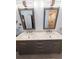 Bathroom featuring double sinks, vanity, with sleek framed mirrors and vanity lighting at 16052 Deer Ridge Dr # B, Morrison, CO 80465
