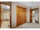 Bedroom with closet space and a doorway leading to an attached bath at 16052 Deer Ridge Dr # B, Morrison, CO 80465