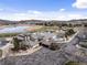 An aerial view of the beautiful clubhouse with a pool and golf course with views of the surrounding community at 16052 Deer Ridge Dr # B, Morrison, CO 80465