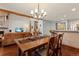 Open dining room with wood floors adjacent to living room and bar seating at 16052 Deer Ridge Dr # B, Morrison, CO 80465