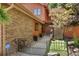 Exterior view showcasing the architecture, landscaping, and gated entryway at 16052 Deer Ridge Dr # B, Morrison, CO 80465